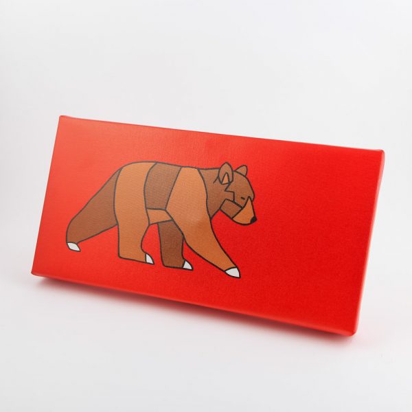 curious bear walking on red