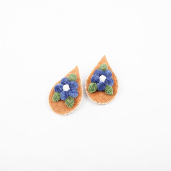 blue hide tufted earrings