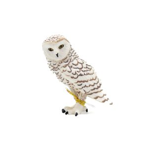 Beautiful plastic figure of a snowy owl against a white background.