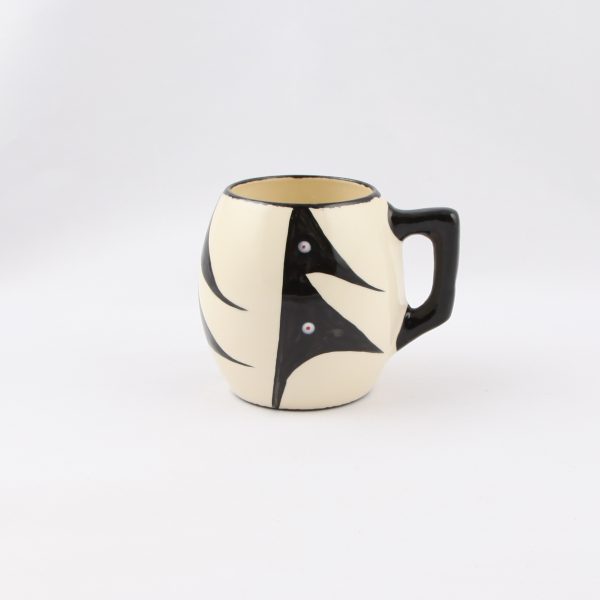 white mug by red and white