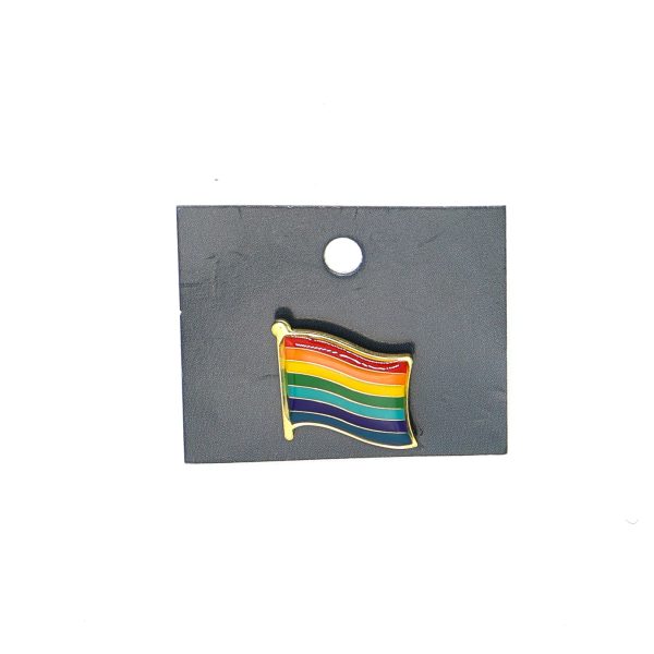 image of the rainbow flag pin in a black package