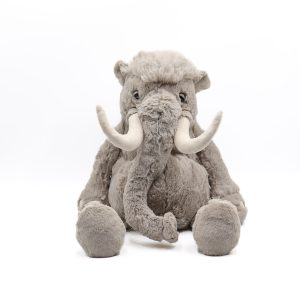 Photographed against a white background, this Jellycat plushie is in the shape of a grey, tusked mammoth.