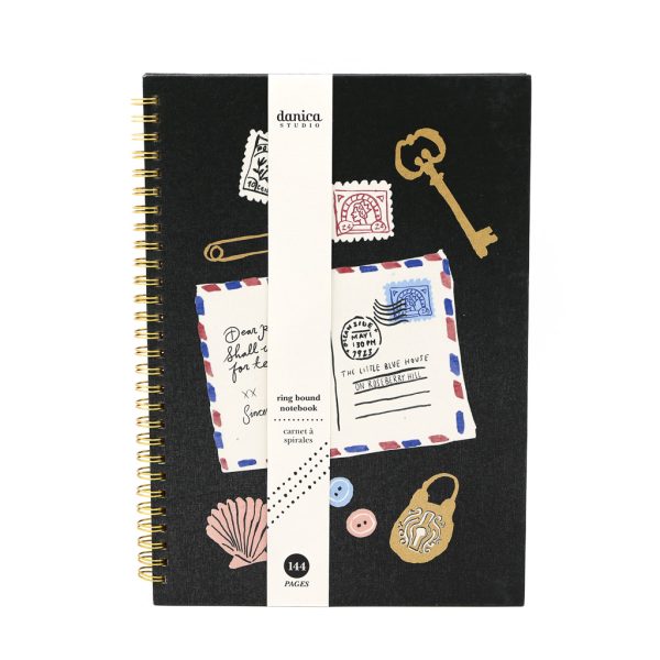 Image of a black coil notebook with whimsicle designs on the front.