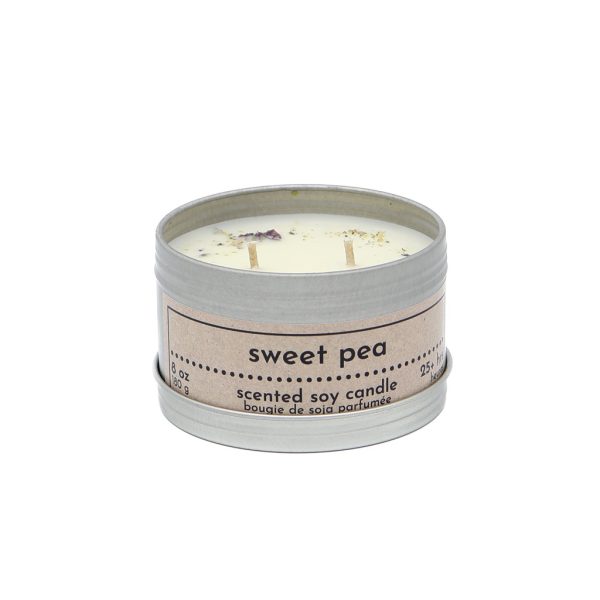 A photo of an 8 oz tin can containing a soy wax candle in the scent of Sweet Pea.