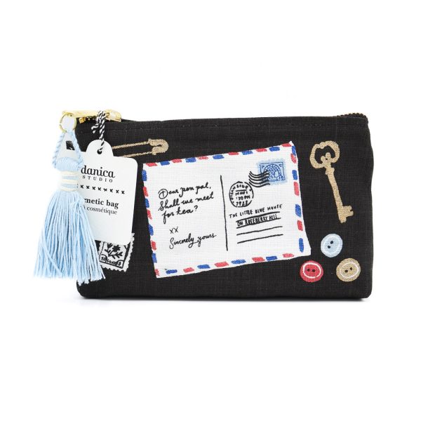 A small black cosmetic bag with images of a handwritten postcard and vintage items like keys decorating the front.