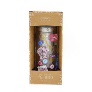 A small clear glass bottle with whimsical designs such as postcards, keys, and more. Has a bamboo lid.