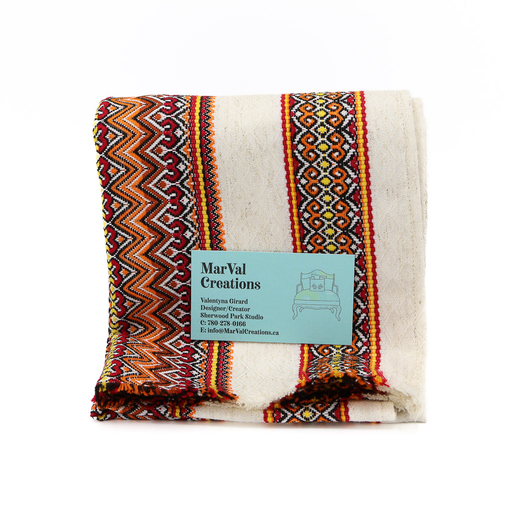 Aug 7 Edited-53 beautifully woven traditional Ukrainian pattern on white cloth with orange and red embroidery. Very complex design.