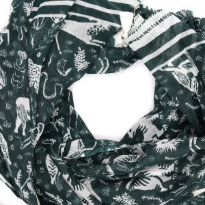 Image of a scarf coiled up on a white background, patterned with grazing animals in white on green.