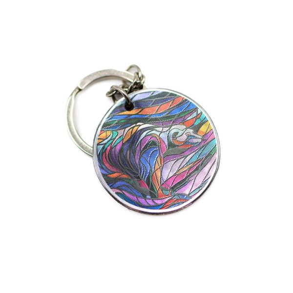 Circular keychain with a beautifully designed metallic version of the piece by Don Chase.