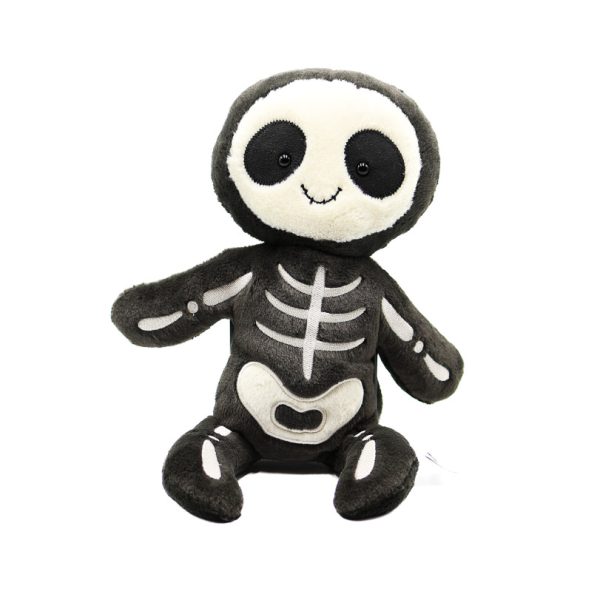 Photographed against a white background, this Jellycat plushie is in the shape of a skeleton person. The bones are white fabric sewn to a black toy, not individual bone shapes.