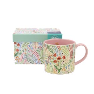 A short mug covered in floral designs in many colours with very little blank space.