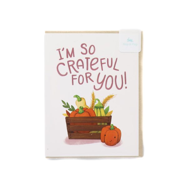 brown envelope with white card that says "I'm So Crateful for You" above an illustration of a crate of gourds.