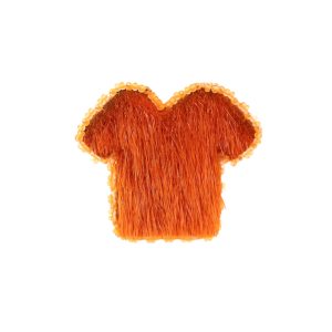 A t-shirt shaped brooch beaded aroumd the edges with orange beads and made with orange fur.
