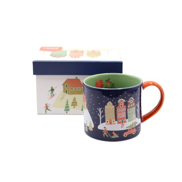 The Candy Cane Lane Mug-In-A-Box is navy blue and patterned with houses and snowy scenes of holiday cheer.
