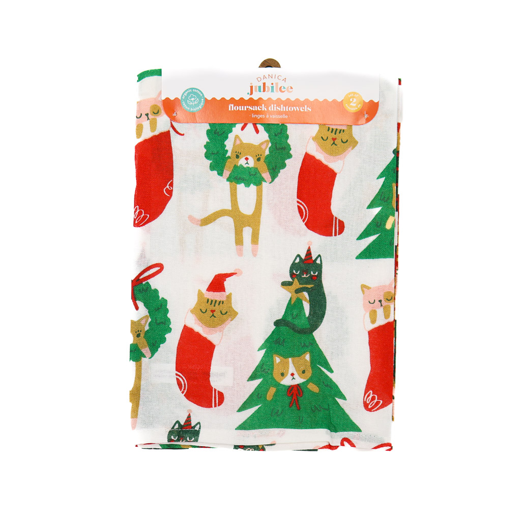 let it meow floursack danica white floursack dishtowel in its packaging, patterned with cats in christmas trees or inside stockings or wreaths.