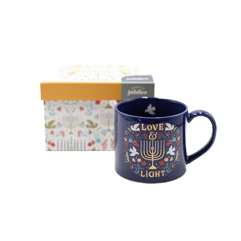 love and light hanukkah mug in a box danica navy blue hanukkah themed mug in front of its box