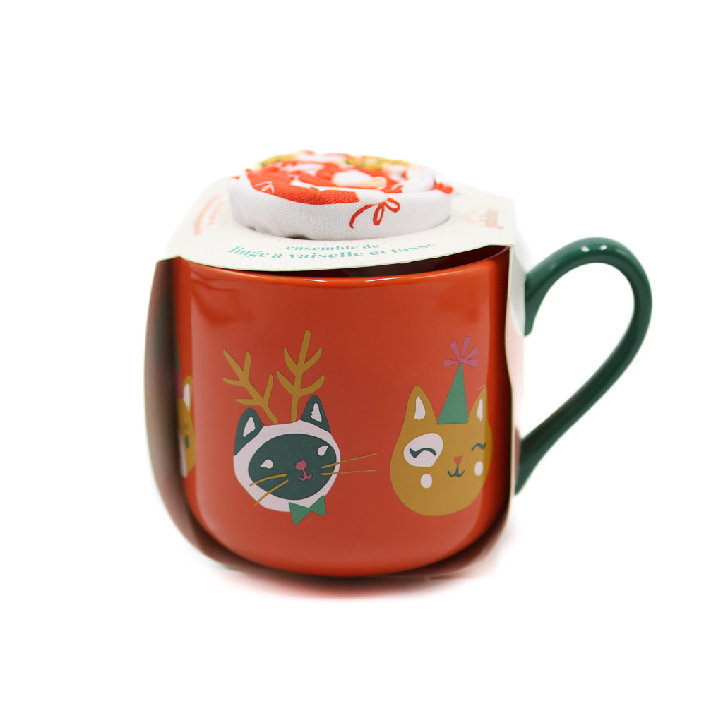 orange mug with christmas cats and a tea towel inside