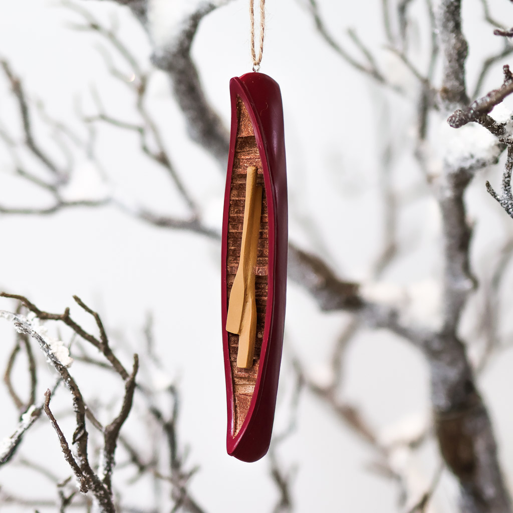 canoe ornament red painted ceramic canoe hanging from the bow.
