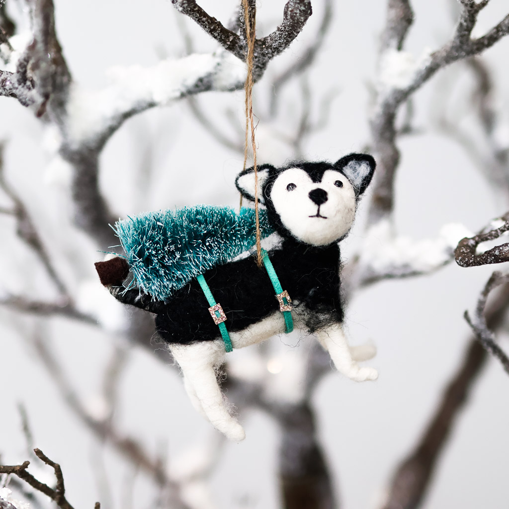felt husky with fir tree ornament a black and white husky dog with a fir tree on its back