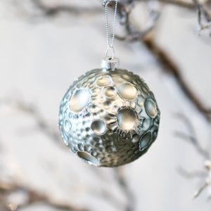 silver and crater covered moon ornament