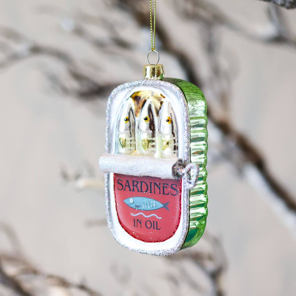 sardines ornament option 2 This beautiful glass ornament looks like a can of halfway opened sardines. It is metallic and well painted.